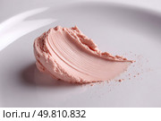 Smear of pink foundation makeup cream on white background. Стоковое AI-изображение, AI-художник Юрий Поздников / Фотобанк Лори