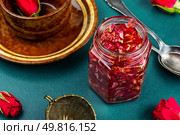 Fragrant homemade rose jam or flower confiture in a glass jar.. Rose jam for tea. Стоковое фото, агентство Ingram Publishing / Фотобанк Лори