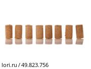 Corks from bottles guilt on white background. Стоковое фото, агентство Ingram Publishing / Фотобанк Лори