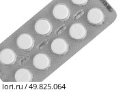 Macro view of white pills on blue background. Стоковое фото, агентство Ingram Publishing / Фотобанк Лори