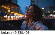 Evening Drive Through the City With a Stylish Woman Enjoying the Urban Scenery. Стоковое AI-видео, аниматор Оксана Медведева / Фотобанк Лори