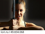 portrait of serious girl with katana. studio shot. Стоковое фото, агентство Ingram Publishing / Фотобанк Лори