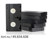 Pile of videotapes on  white reflective background. Стоковое фото, агентство Ingram Publishing / Фотобанк Лори