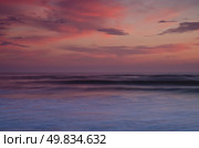 Sunset on a beach, beautiful sky and silky water. Стоковое фото, агентство Ingram Publishing / Фотобанк Лори