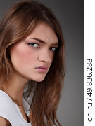 portrait of concerned about the problems girl. Studio shot. Стоковое фото, агентство Ingram Publishing / Фотобанк Лори
