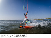 Kiteboarder enjoy surfing on a sunny day. Стоковое фото, агентство Ingram Publishing / Фотобанк Лори