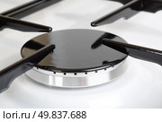 Stove gas burner a fragment. Close up shot with selective focus. Стоковое фото, агентство Ingram Publishing / Фотобанк Лори