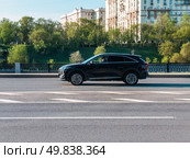 Haval Shenshou car driving in city with motion blur, view from the side. Редакционное фото, фотограф Константин Григорьев / Фотобанк Лори