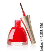 Red nail polish and brush isolated on a white background. Стоковое фото, агентство Ingram Publishing / Фотобанк Лори