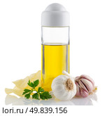 Garlic and olive oil still life rotating isolated on white background. and olive oil isolated on white background. Стоковое фото, агентство Ingram Publishing / Фотобанк Лори