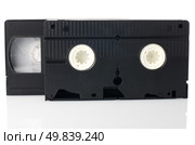 Old VHS Video tapes isolated on white background. Стоковое фото, агентство Ingram Publishing / Фотобанк Лори