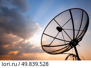 Big telecommunication satellite dish over sunset sky. Стоковое фото, агентство Ingram Publishing / Фотобанк Лори