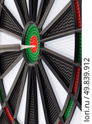 Closeup of dart board with dart. Стоковое фото, агентство Ingram Publishing / Фотобанк Лори