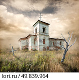 aAbandoned church near the cemetery in a field. Стоковое фото, агентство Ingram Publishing / Фотобанк Лори