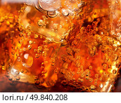 Background of cola with ice and bubbles. Стоковое фото, агентство Ingram Publishing / Фотобанк Лори