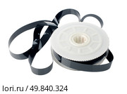 Videotape reel on  white reflective background. Стоковое фото, агентство Ingram Publishing / Фотобанк Лори