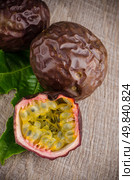 Passion fruits on wooden background. Стоковое фото, агентство Ingram Publishing / Фотобанк Лори