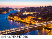 Porto Cityscape Portugal at dusk with Dom Luiz bridge. Стоковое фото, агентство Ingram Publishing / Фотобанк Лори