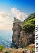 Rocks in the sea under cloudy sky. Стоковое фото, агентство Ingram Publishing / Фотобанк Лори