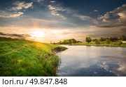 Reflection in the calm river at sunset. Стоковое фото, агентство Ingram Publishing / Фотобанк Лори