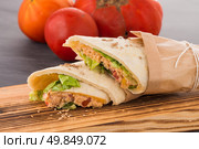 Tortillas with chicken and vegetables, on chalk board table. Стоковое фото, агентство Ingram Publishing / Фотобанк Лори