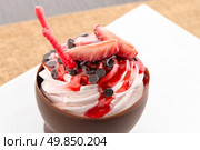 Tasteful strawberry and chocolate pastry mousse on white plate background. Стоковое фото, агентство Ingram Publishing / Фотобанк Лори