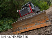 Dirty tractor in the ground. Стоковое фото, агентство Ingram Publishing / Фотобанк Лори