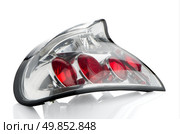 Rear automobile lamp detail on white reflective background. Стоковое фото, агентство Ingram Publishing / Фотобанк Лори