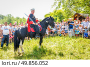 Russia, Samara, June 2016: A dashing Cossack on horseback during a demonstration performance at the Journey to the Past festival. Редакционное фото, фотограф Акиньшин Владимир / Фотобанк Лори