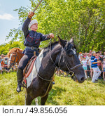 Russia, Samara, June 2016: A dashing Cossack on horseback during a demonstration performance at the Journey to the Past festival. Редакционное фото, фотограф Акиньшин Владимир / Фотобанк Лори