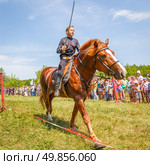 Russia, Samara, June 2016: A dashing Cossack on horseback during a demonstration performance at the Journey to the Past festival. Редакционное фото, фотограф Акиньшин Владимир / Фотобанк Лори