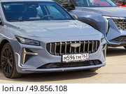 Russia, Samara. 23. 04 2025. Geely cars of the Chinese company Geely Holding are in the showroom for sale on a summer sunny day. Text in Russian: Samara auto, special price, special offer. Редакционное фото, фотограф Акиньшин Владимир / Фотобанк Лори