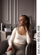 Contemplative Moments of a Lonely Woman Reflecting on Her Mind in a Quiet Indoor Space. Стоковое фото, фотограф Aleksandr Golubev / Фотобанк Лори