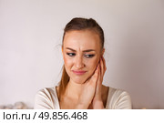 Emotions Captured in a Moment of Reflection and Vulnerability From a Young Woman in a Studio Setting. Стоковое фото, фотограф Aleksandr Golubev / Фотобанк Лори