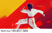 A martial artist in a white gi and red belt executes a karate move with focus and power. Стоковое AI-изображение, AI-художник Данила Большаков / Фотобанк Лори