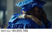 A woman in a graduation gown embraces a man warmly, celebrating their achievement together. Стоковое AI-изображение, AI-художник Данила Большаков / Фотобанк Лори