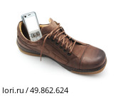 Mobile phone in shoe. Concept design. Стоковое фото, агентство Ingram Publishing / Фотобанк Лори