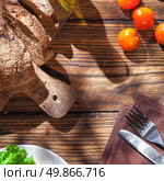 Top view of italian food on wooden table - bread, olive oil and tomatos with basil. Стоковое фото, агентство Ingram Publishing / Фотобанк Лори