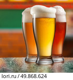 Different beer in glasses in pub. Стоковое фото, агентство Ingram Publishing / Фотобанк Лори
