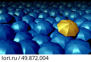 Individual thinking business symbol with a large group of blue umbrellas and standing out from the crowd as a confident yellow umbrella as icons of protection and financial security. Стоковое фото, агентство Ingram Publishing / Фотобанк Лори