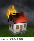 House fire and burning home insurance symbol with a burnt damaged residential structure that shows the destruction in flames  and the importance of  smoke alarm and security systems. Стоковое фото, агентство Ingram Publishing / Фотобанк Лори
