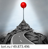 Achieving your goals and following the difficult challenging path to success with a mountain of tangled roads and highways leading to the top with a location red pushpin as a symbol of determination. Стоковое фото, агентство Ingram Publishing / Фотобанк Лори