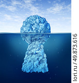 Searching for the key to success with an iceberg shaped as a an icon of solutions security with the top in view and the rest hidden under arctic cold ocean as a life and business symbol of hope. Стоковое фото, агентство Ingram Publishing / Фотобанк Лори