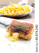 Chicken cordon bleu with deep fried potato. Стоковое фото, агентство Ingram Publishing / Фотобанк Лори
