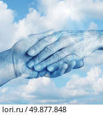 Saying goodbye mourning and grief concept with the hand of a young person letting go an elderly senior who is in the final stages of life on a sky background as a symbol of heaven and emotional feelings related to terminal patients. Стоковое фото, агентство Ingram Publishing / Фотобанк Лори