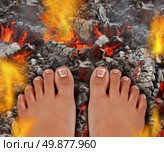 Walk on fire as a life and culture concept of the power of faith and mind over matter as a rite of passage ritual and ancient tradition walking over hot burning coals with fire flames and smoke. Стоковое фото, агентство Ingram Publishing / Фотобанк Лори