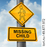 Child missing concept with a yellow school crossing traffic warning sign with a dotted figure of a little girl as a symbol of children losing their childhood as being lost in a failed adoption or despair due to abduction. Стоковое фото, агентство Ingram Publishing / Фотобанк Лори