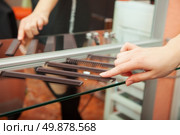 set of combs on the shelf in the barbershop. Стоковое фото, агентство Ingram Publishing / Фотобанк Лори