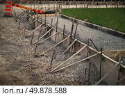 Road Construction and city street revitalisation with government infrastructure projects as a work site with cement scaffolding molds and unfinished roads as an economic growth symbol of city planning or town development. Стоковое фото, агентство Ingram Publishing / Фотобанк Лори