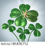 Create your success and taking control of your destiny with a three leaf clover being changed to good luck four leaves by taping an extra petal to the plant as a business concept  of  empowerment and increasing chances for good fortune. Стоковое фото, агентство Ingram Publishing / Фотобанк Лори